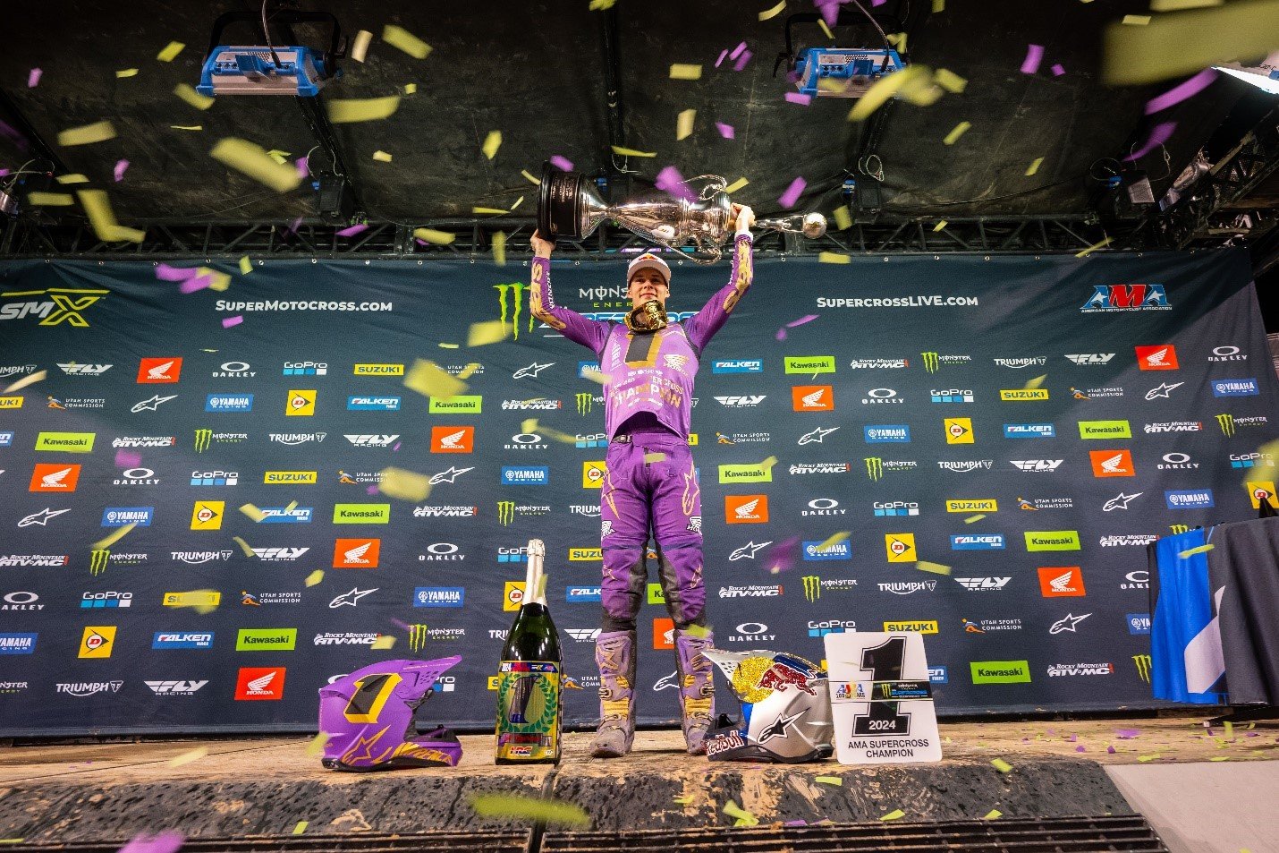 Jett Lawrence celebrating on the podium at Rice-Eccles Stadium in Salt Lake City after winning the Monster Energy AMA Supercross Championship. Photo Credit: Feld Motor Sports, Inc.